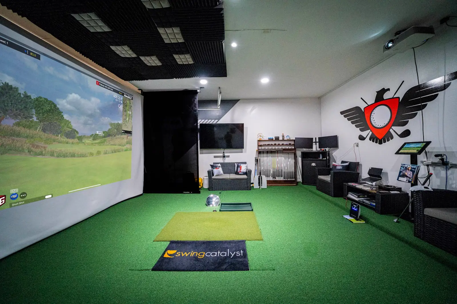 Eagle Quest indoor bay: simulator screen, Swing Catalyst mat, and one hitting station